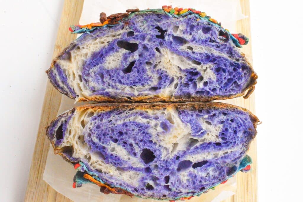 Cross section of baked sourdough with purple and white marbling. 