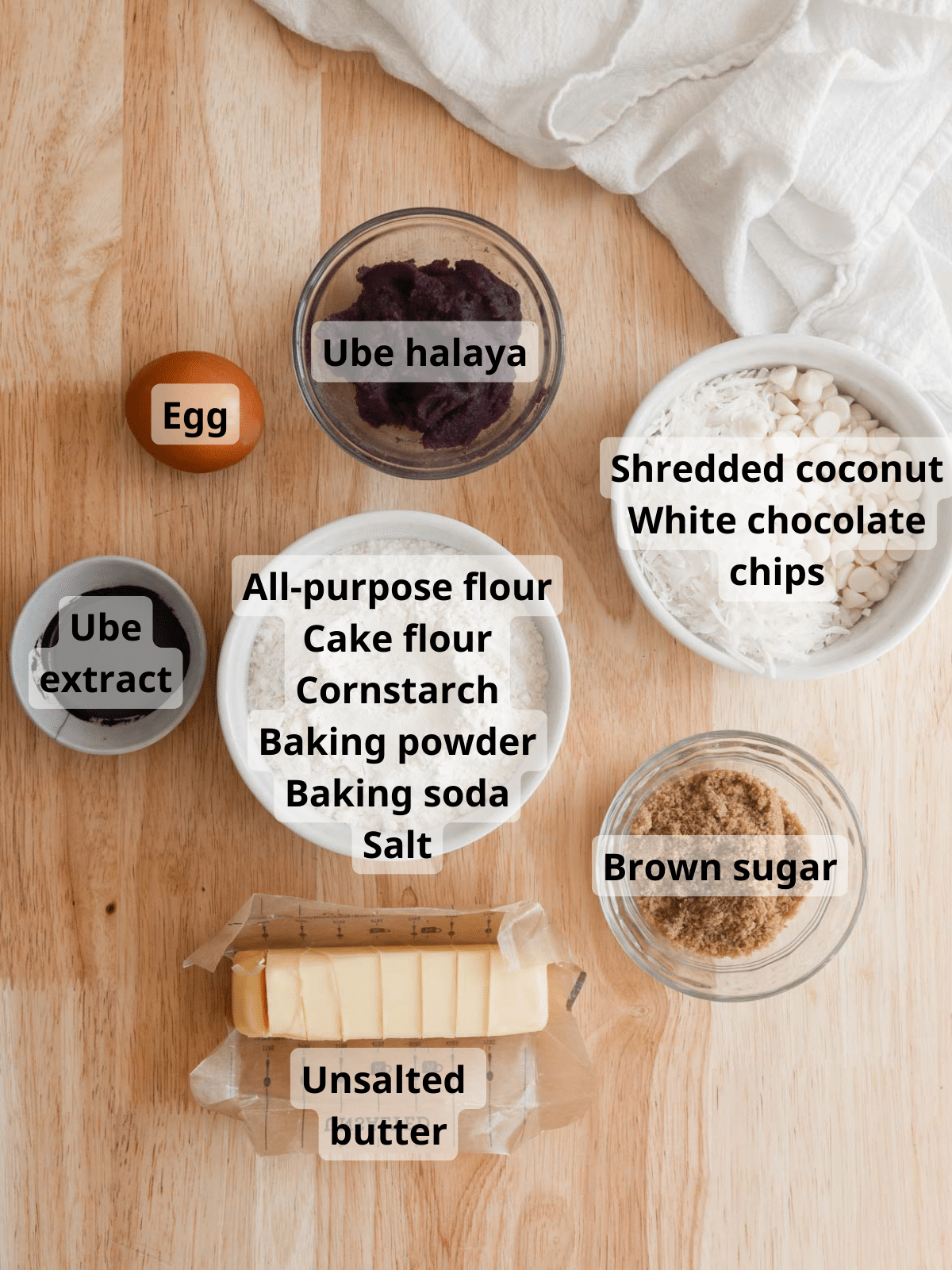 Labeled ingredients laid out on a wooden table.