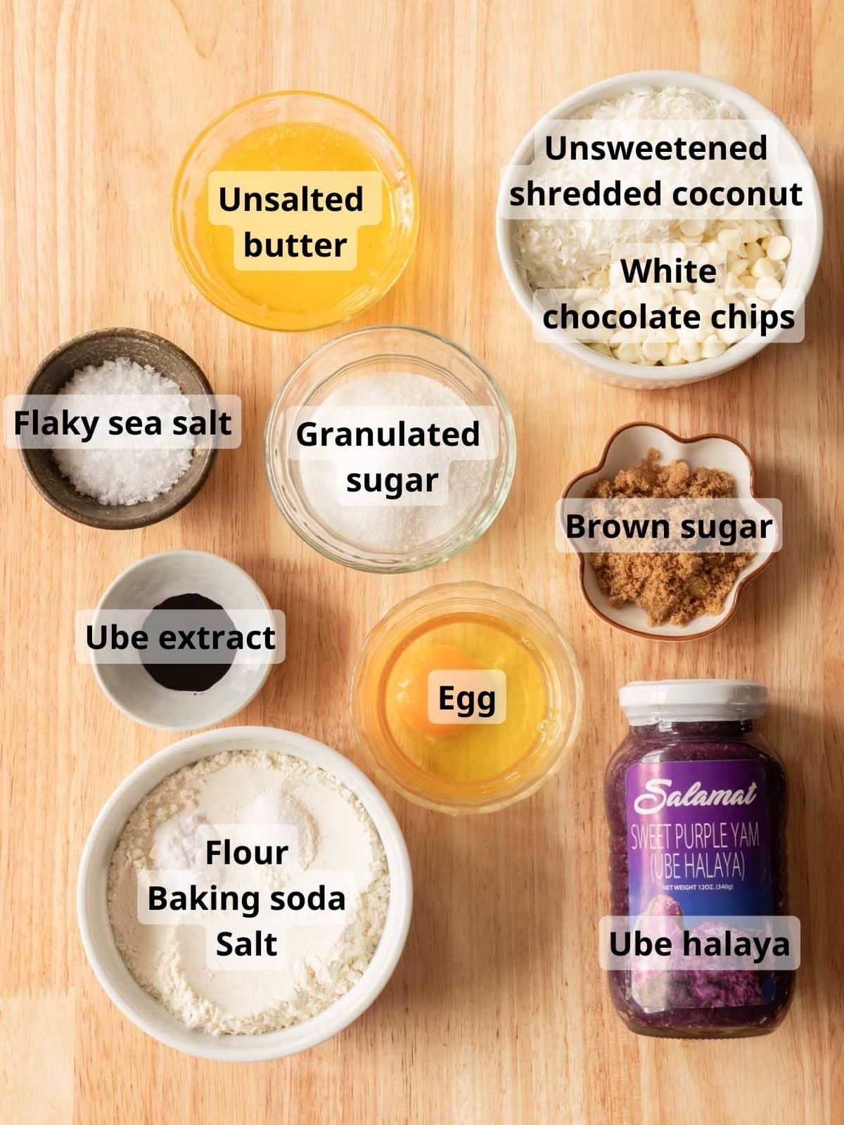 Ube cookie ingredients laid out on wooden table.