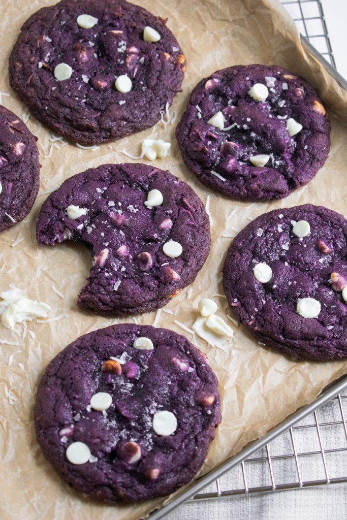 thin and chewy ube cookies with white chocolate chips and coconut