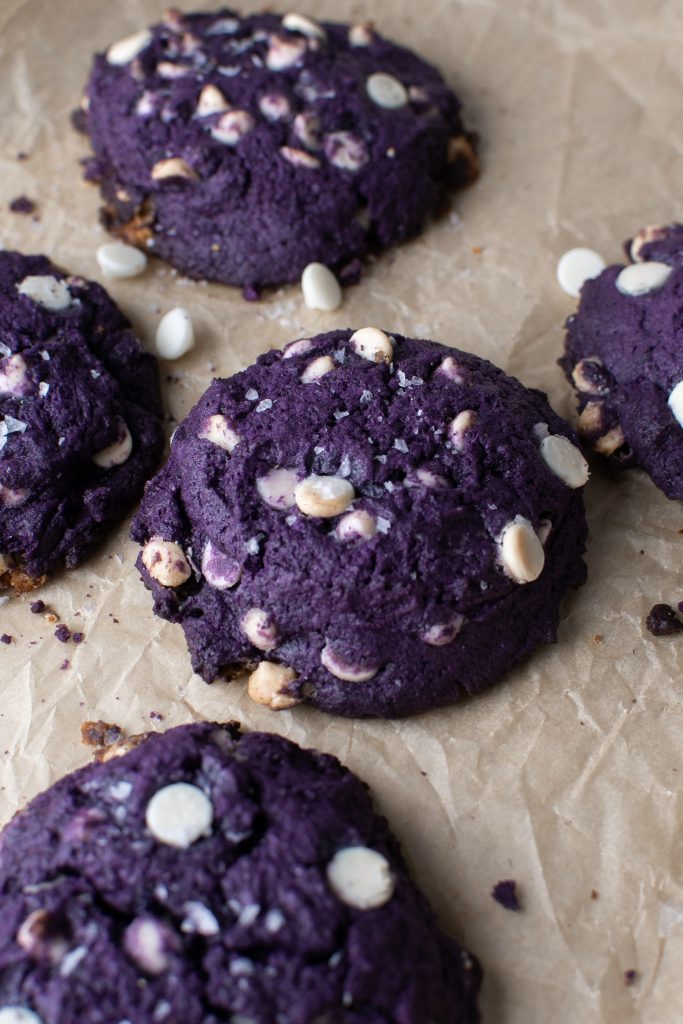 Chunky ube cookies with white chocolate and shredded coconut.