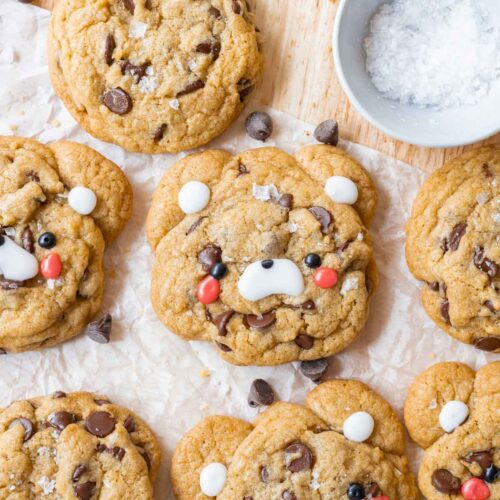 Cute teddy bear chocolate chip cookies decorated with cookie icing.