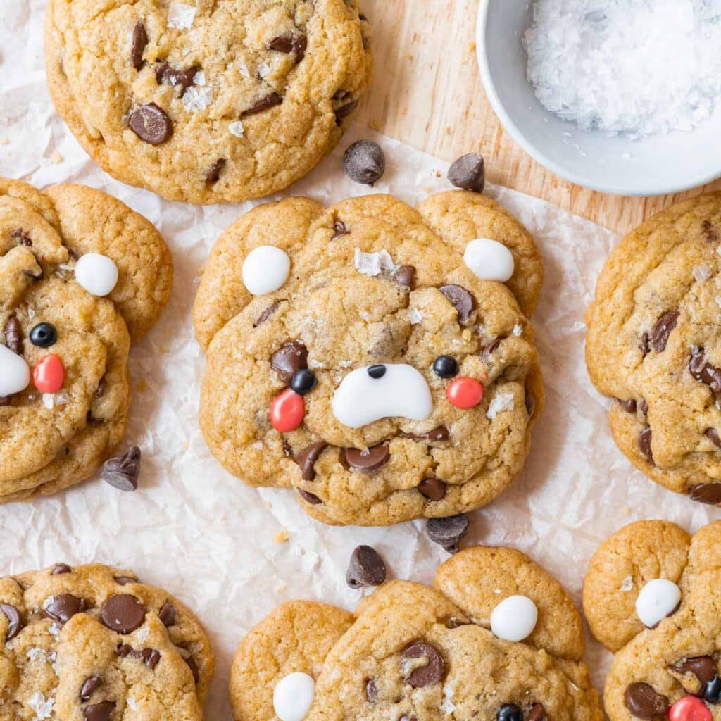 Cute teddy bear chocolate chip cookies decorated with cookie icing.