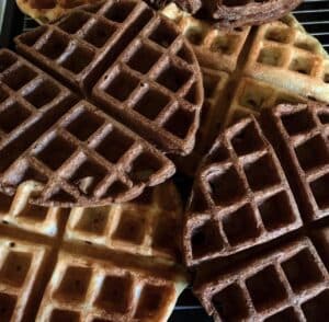 Photo from ~2019 of sourdough waffles spread out over a rack 