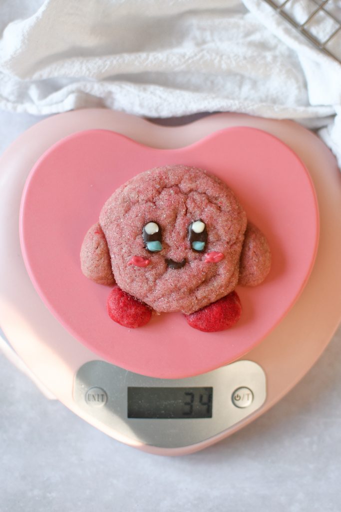 Large kirby cookie on heart-shaped scale