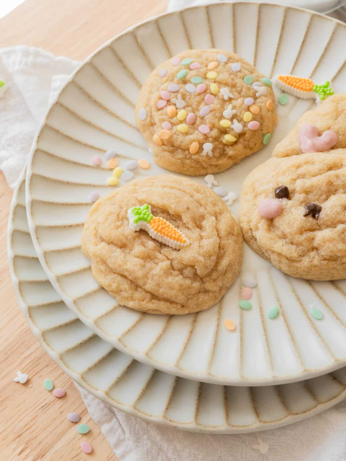 Cute Easter sugar cookies: carrot sprinkle cookie, bunny cookie, and pastel sprinkles cookie.