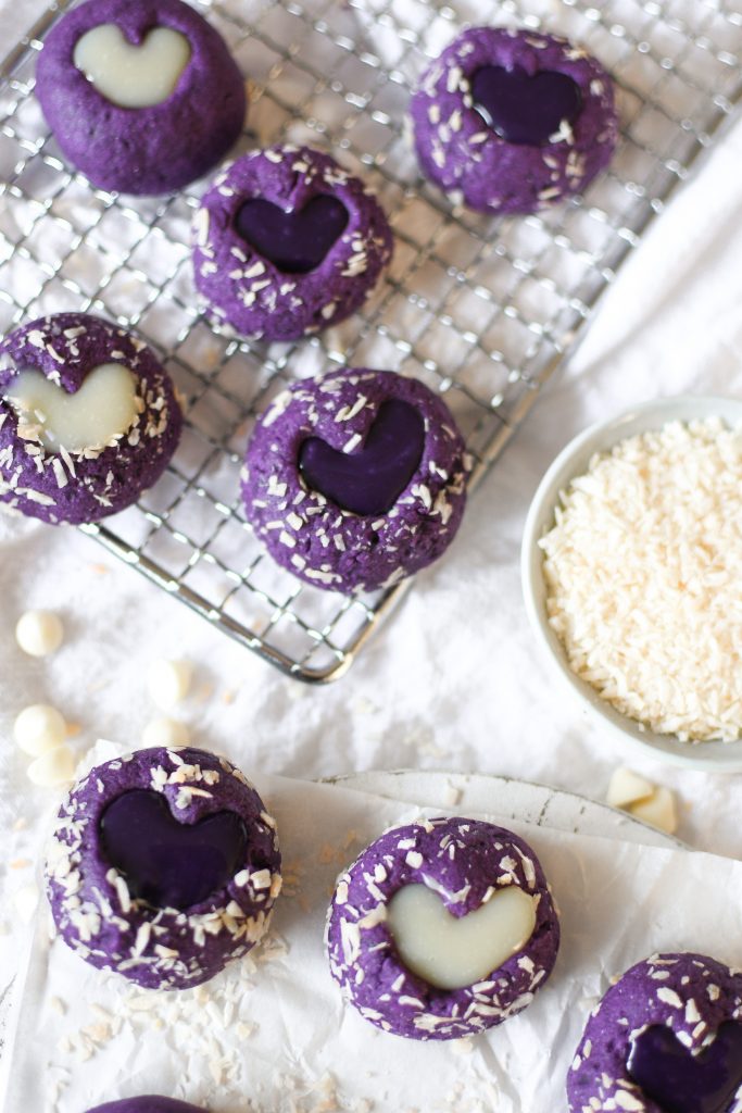 Ube thumbprint cookies on a wire rack 