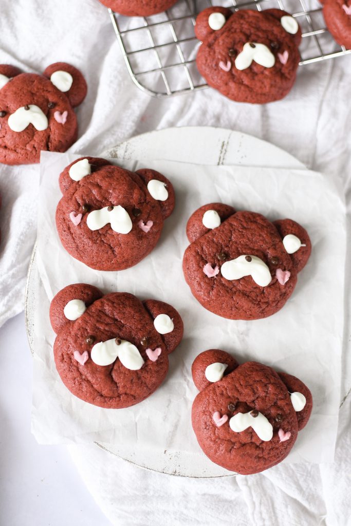 Red velvet bear shaped cookies on parchment paper