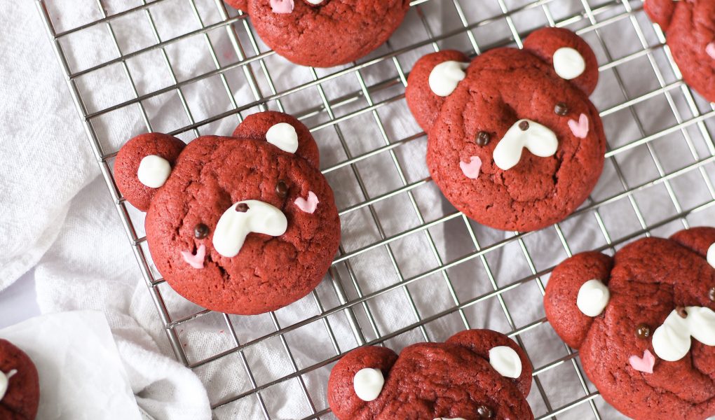 Red velvet bear cookies on wire rack