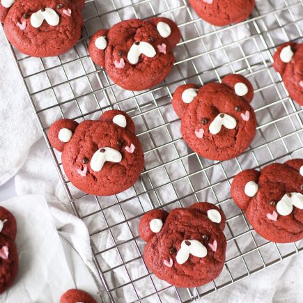 Red velvet bear cookies on wire rack