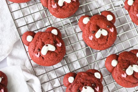 Red velvet bear cookies on wire rack