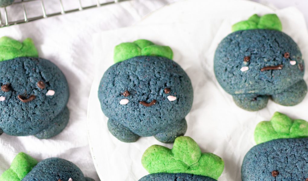 Oddish cookies on parchment paper and wire rack