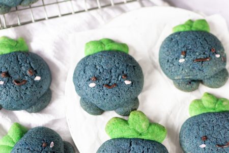 Oddish cookies on parchment paper and wire rack