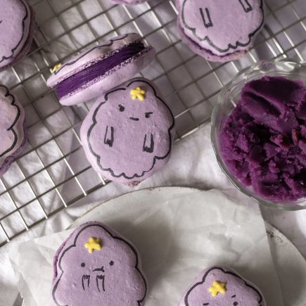 ube cheesecake lumpy space princess macarons on a wire rack w