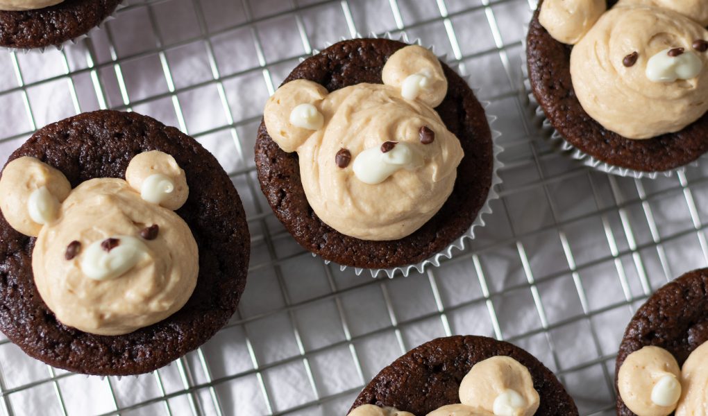 Chocolate peanut butter bear cupcakes on wire rack