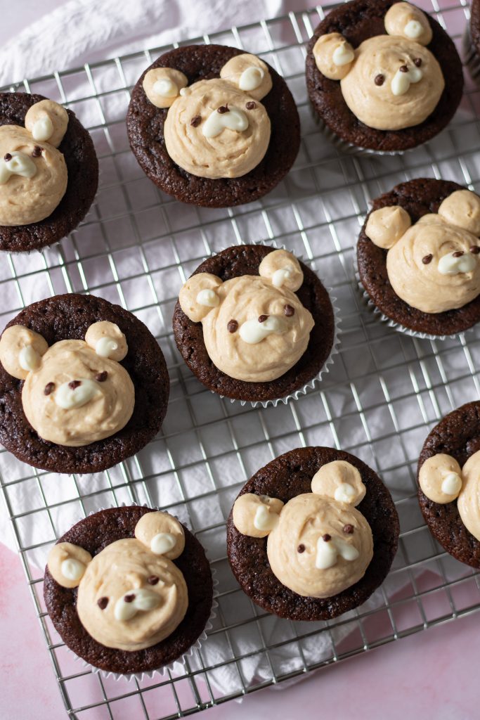 Chocolate peanut butter bear cupcakes on wire rack