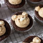 almond flour Chocolate bear cupcakes with peanut butter whipped cream frosting on wire rack