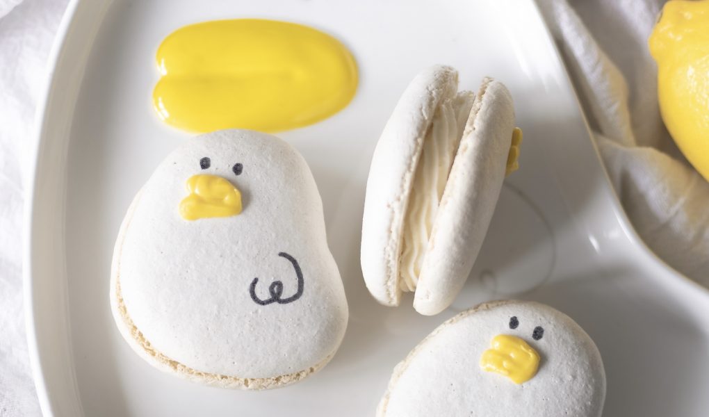 Lemon cheesecake macarons on a duck plate
