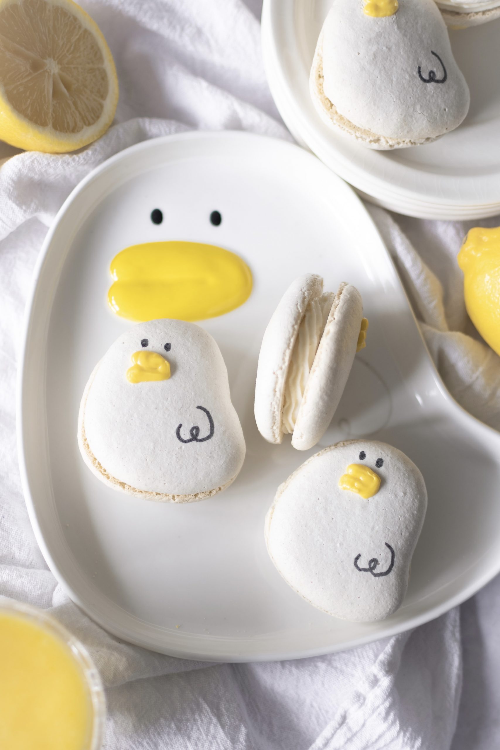 Lemon cheesecake macarons on a duck plate