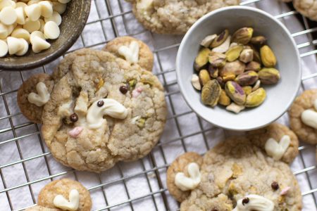 Cute pistachio cookies on a wire rack