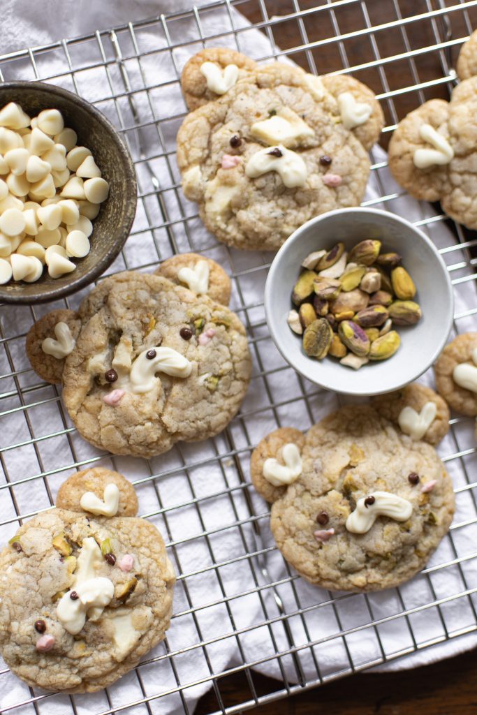 Cute pistachio cookies on a wire rack