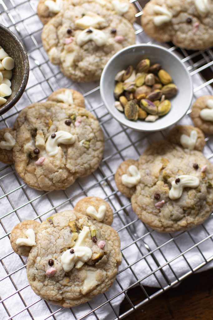 White chocolate pistachio cookies on wire rack