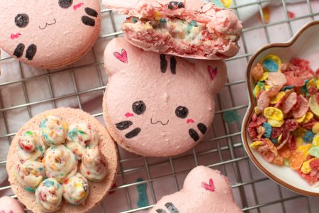 Fruity pebbles cat macarons on a wire rack