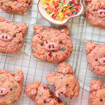 Fruity pebbles pig cookies on a wire rack