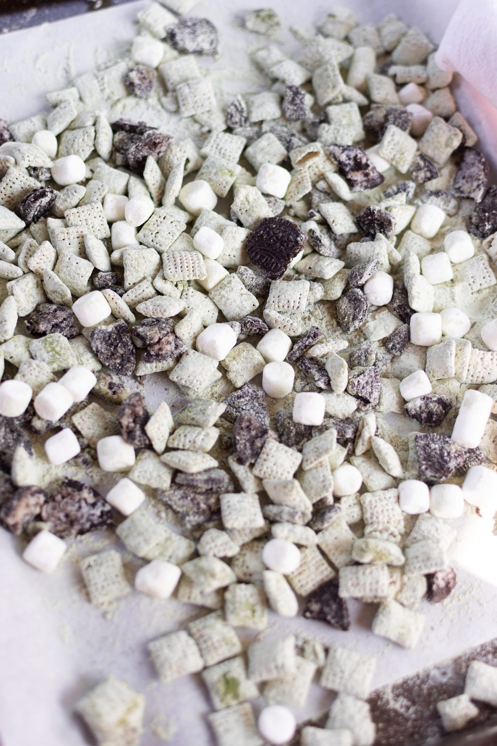 Matcha oreo puppy chow on parchment