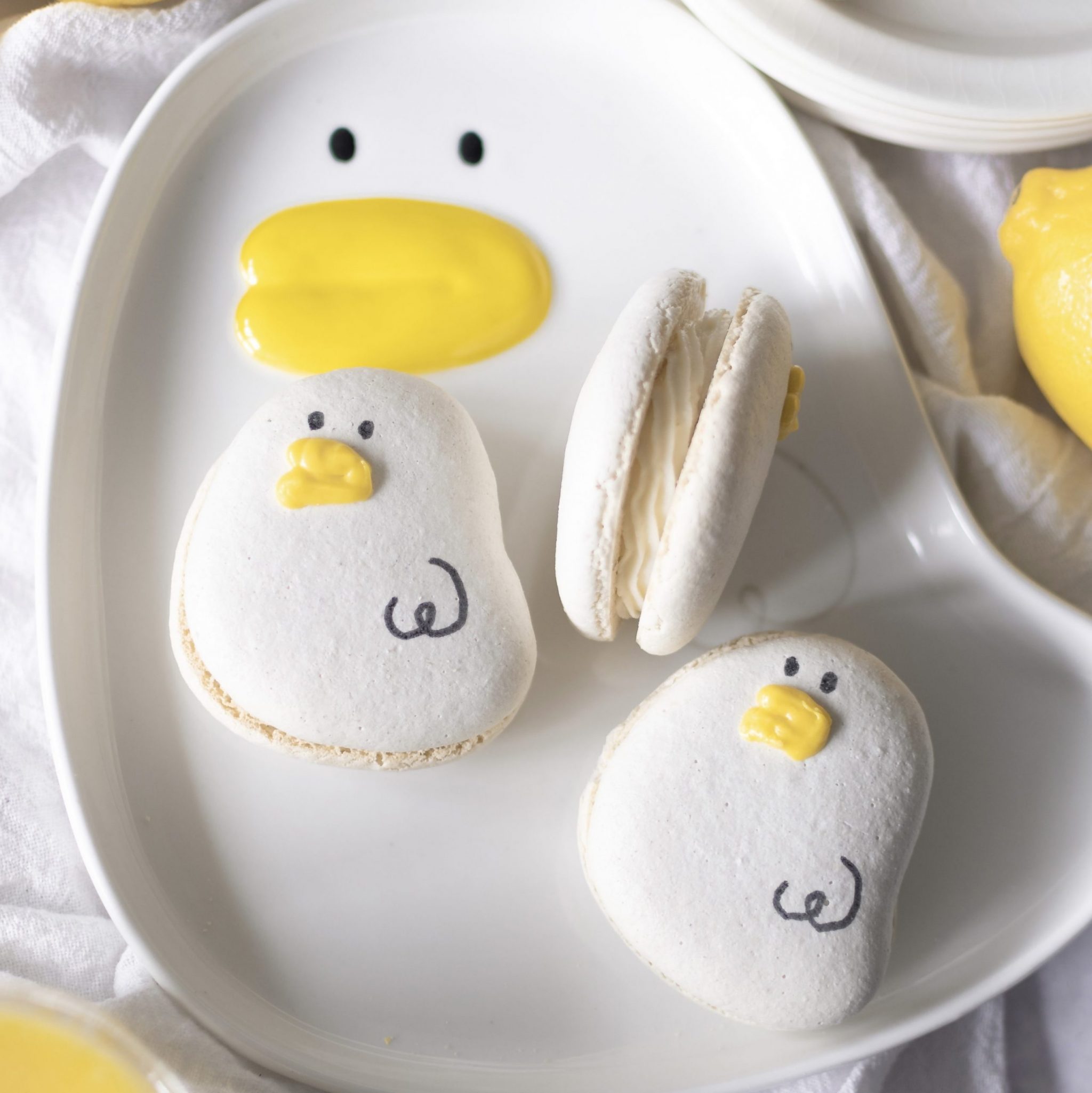 Lemon cheesecake macarons on a duck plate