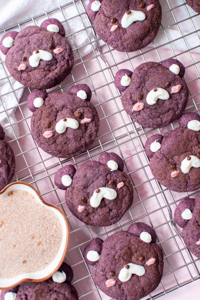 Cute ube cookies on a wire rack