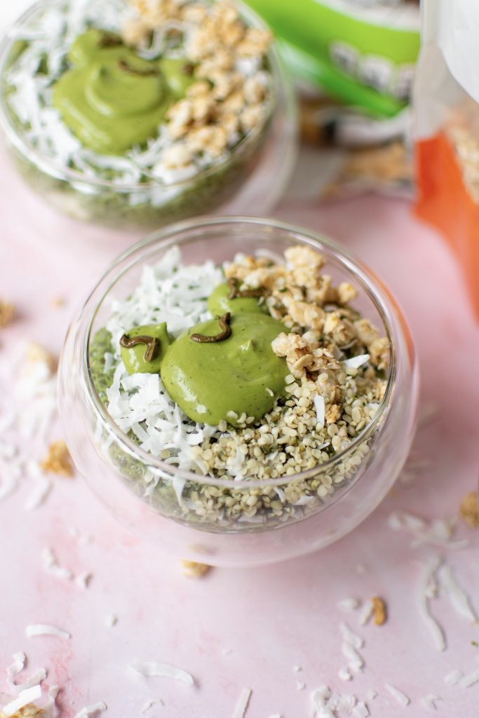 Cute frog chia seed pudding topped with hemp seeds and granola