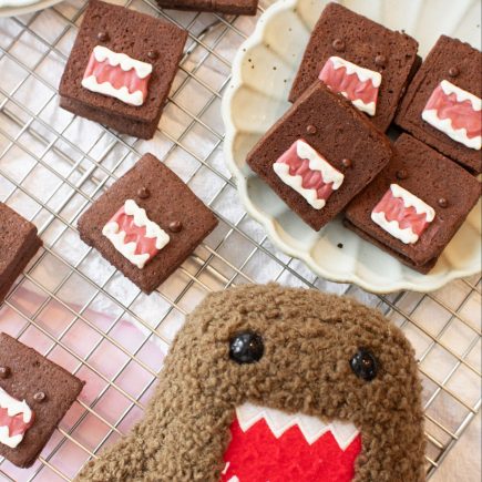 double chocolate shortbread cookies next to domo plushie