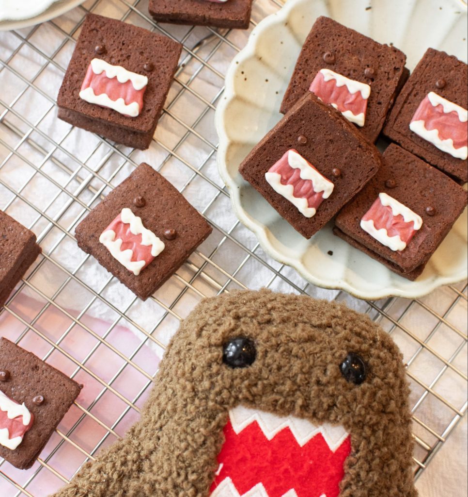 double chocolate shortbread cookies next to domo plushie