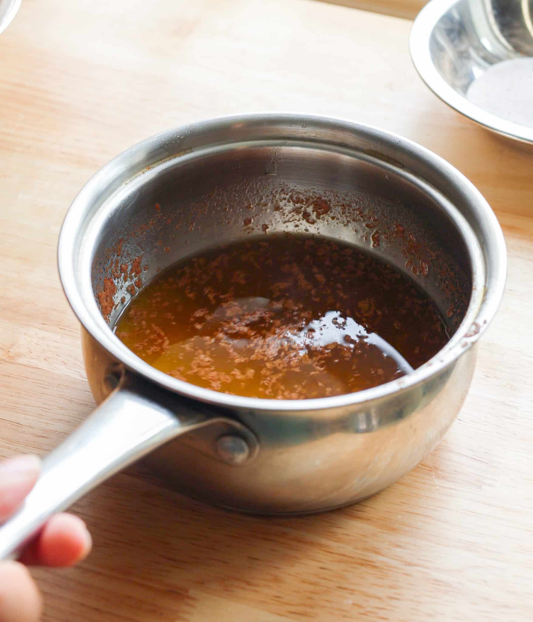 Melted butter and pumpkin spice in a pot.