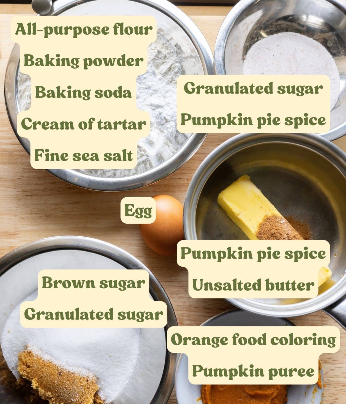 Labeled pumpkin snickerdoodle ingredients on a wooden table.