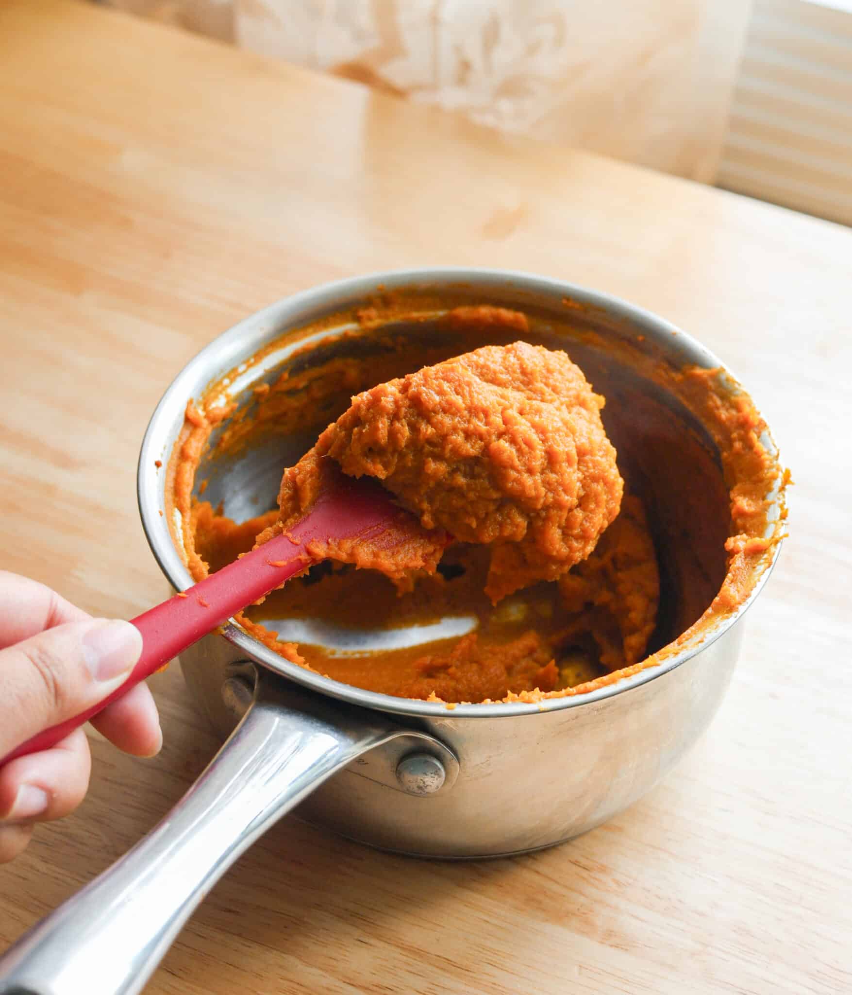 Reduced pumpkin puree that was cooked down in a pot.
