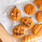 Pumpkin cookies decorated as jack o'lanterns.