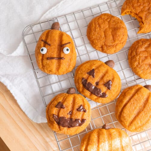 Pumpkin cookies decorated as jack o'lanterns.