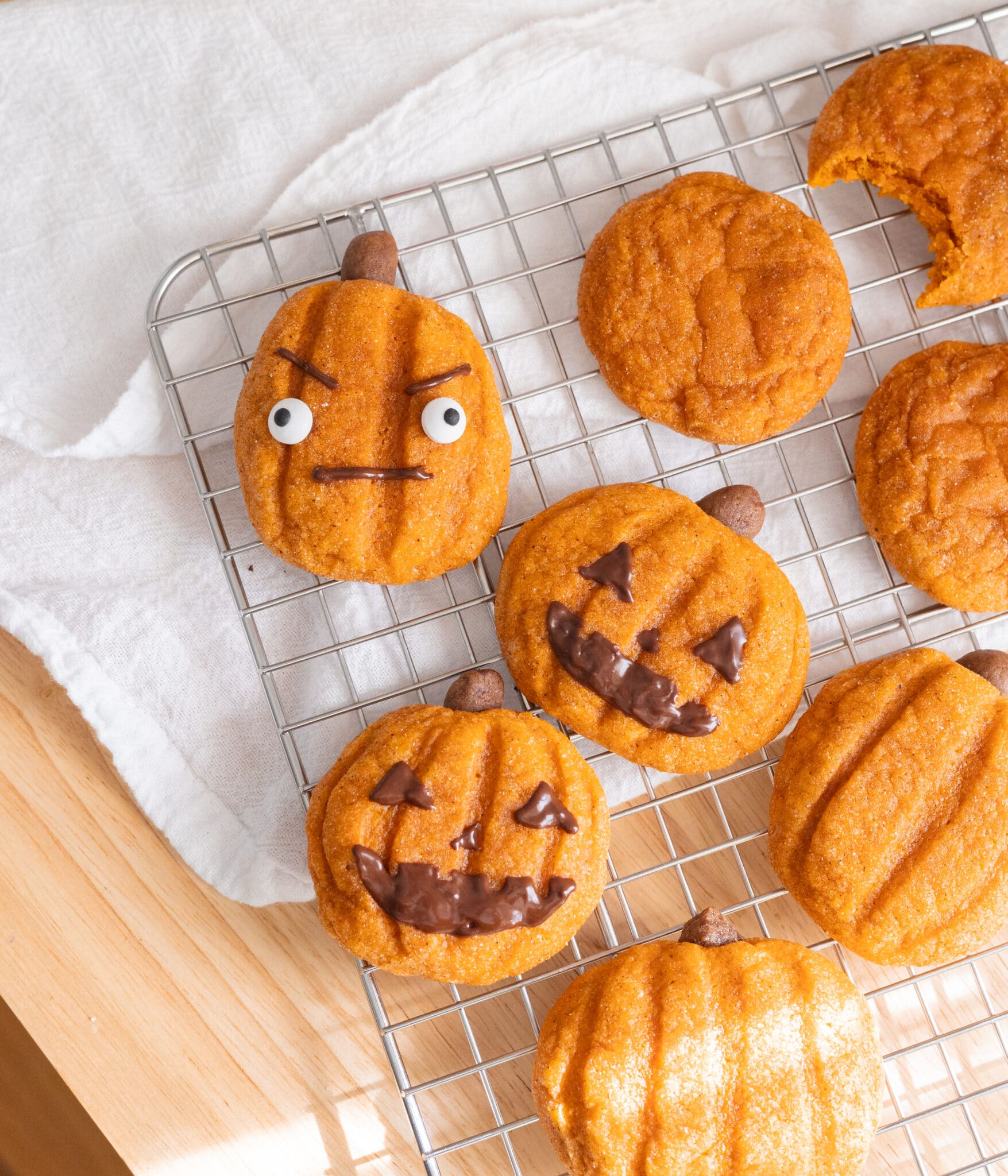 Pumpkin cookies decorated as jack o'lanterns.
