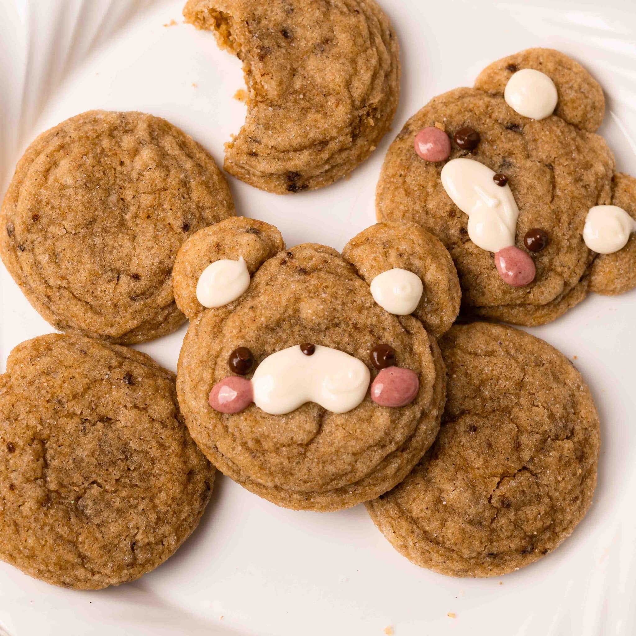 cute brown butter sugar cookies on a white plate, decorated as bears