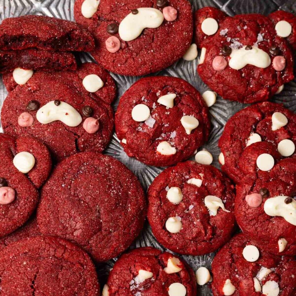 Cute red velvet cookies on a baking pan