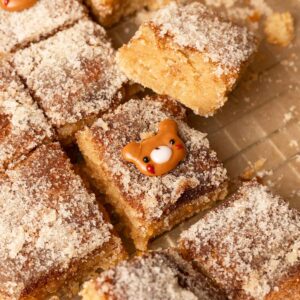 Chewy snickerdoodle bars with cute bear decoration on top.