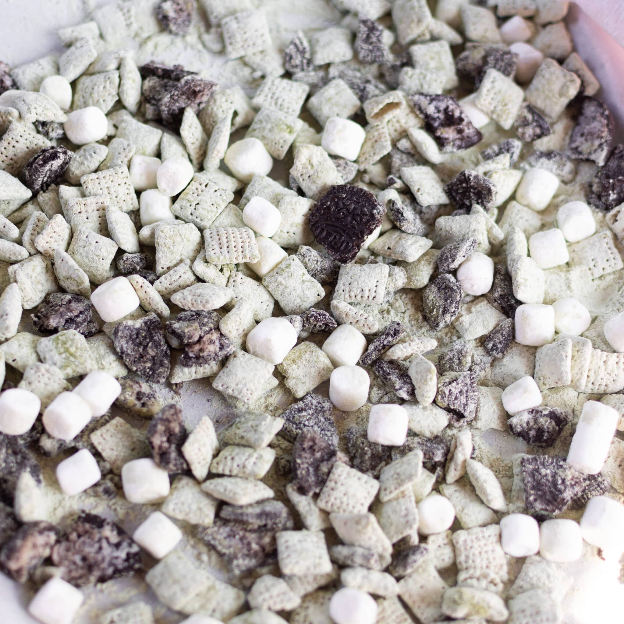 Matcha oreo puppy chow on parchment