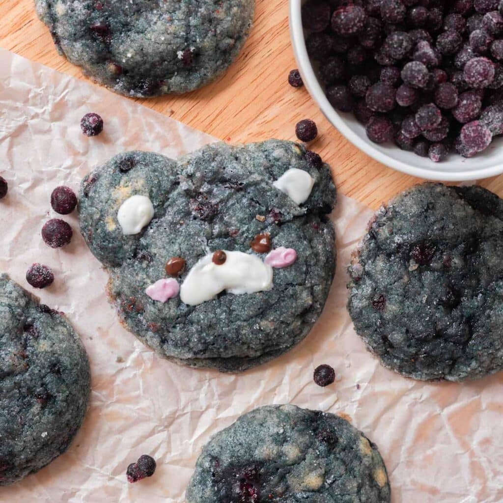 Blueberry sugar cookie on parchment paper.