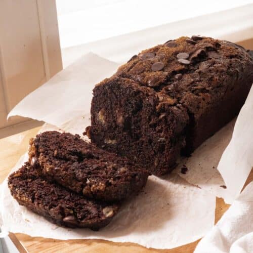 Double chocolate banana bread on wooden table.