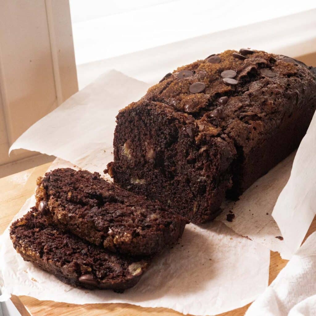 Chocolate banana bread on wooden table.