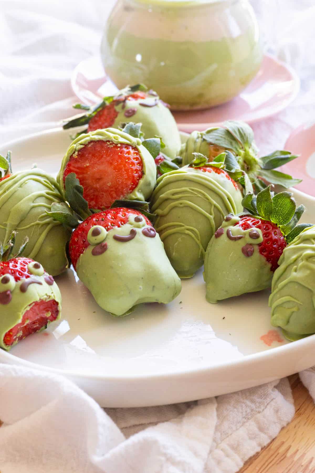 Cute matcha covered strawberries decorated as frogs.