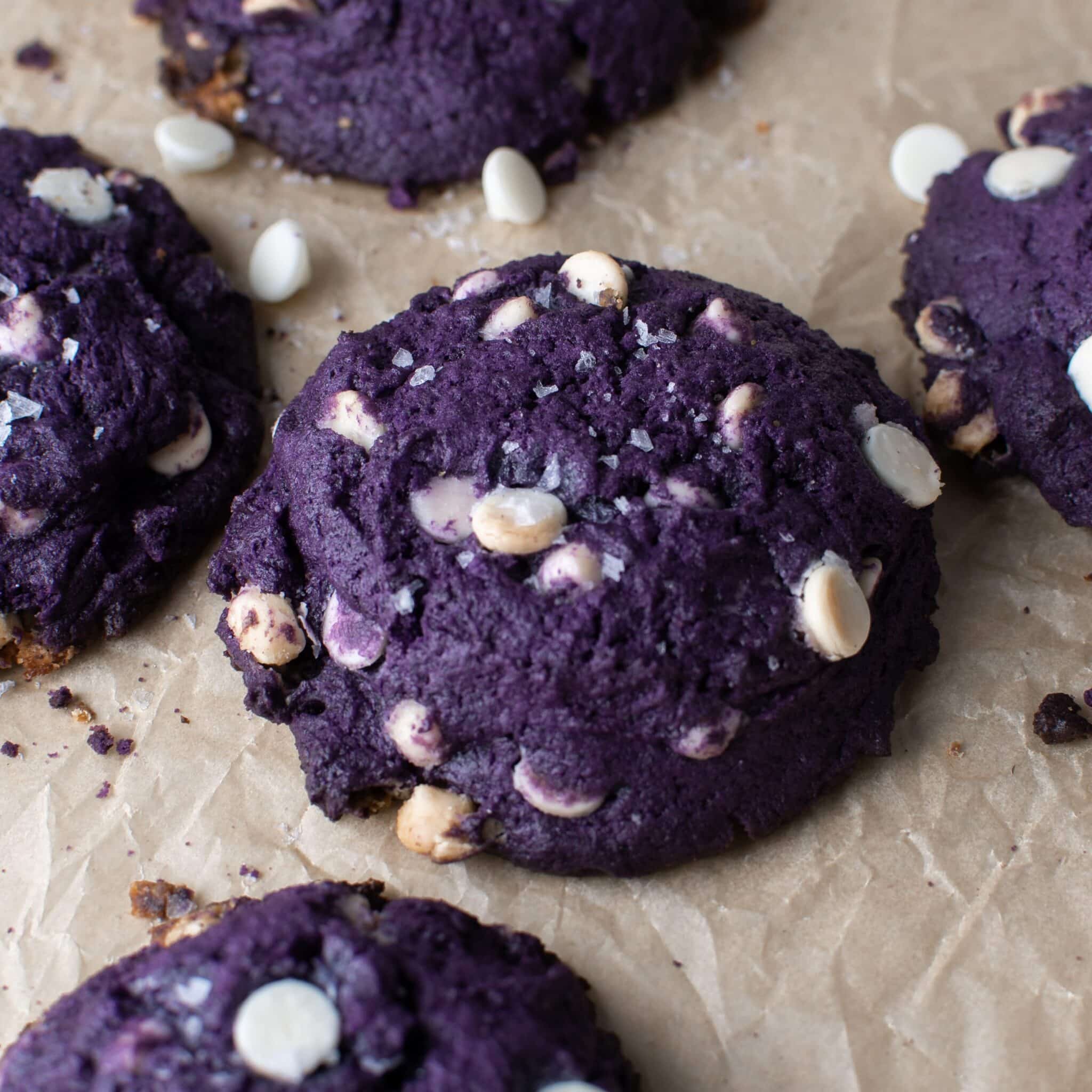 Chunky ube cookies with white chocolate and shredded coconut.