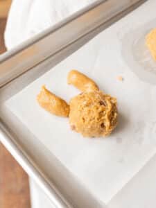 Cookie dough shaped as a bunny on a baking tray.